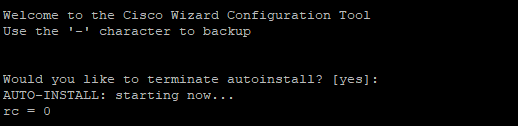 The controller booting up and starting the auto install process Terminal output showing WLC attempting to terminate auto install